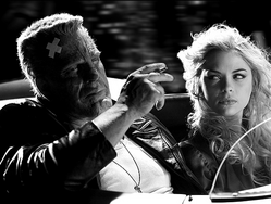 Mickey Rourke as Marv and Jaime King as Wendy in a scene from the Sin City movie.