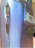 (1) Trackwheel, (2) Escape key and (3) radio/phone speaker on the BlackBerry 7510